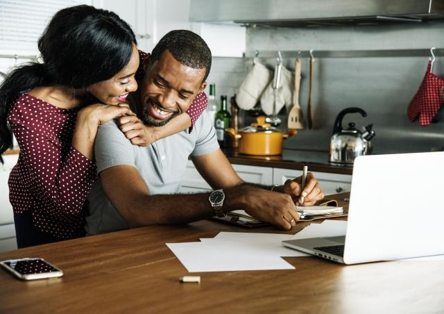 Couple happy at computer